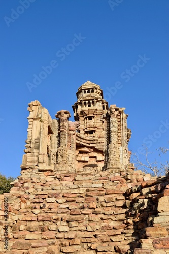 Low angle view of tower of victory with ruined architecture