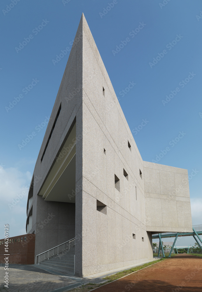 Exterior shot of a commercial building against clear blue sky Exterior shot of a commercial building against clear blue sky