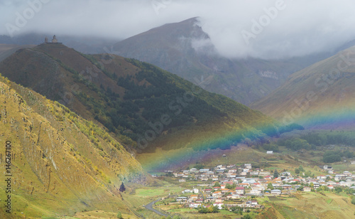Rainbow over the Georgian village of Stepantsminda after the rain