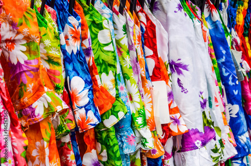 Closeup of different colored pattern fabrics or dresses on display in store