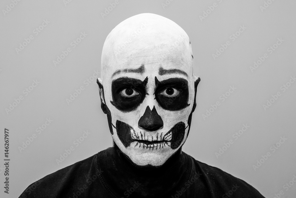 Naklejka premium Beautiful man with creative make-up for the Halloween party