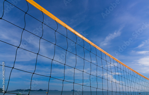 Closeup of Beach volleyball net on the beach with a clear and sunny sky © morkdam