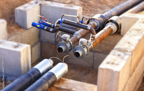 The process of installation of the distribution unit heating network. photo