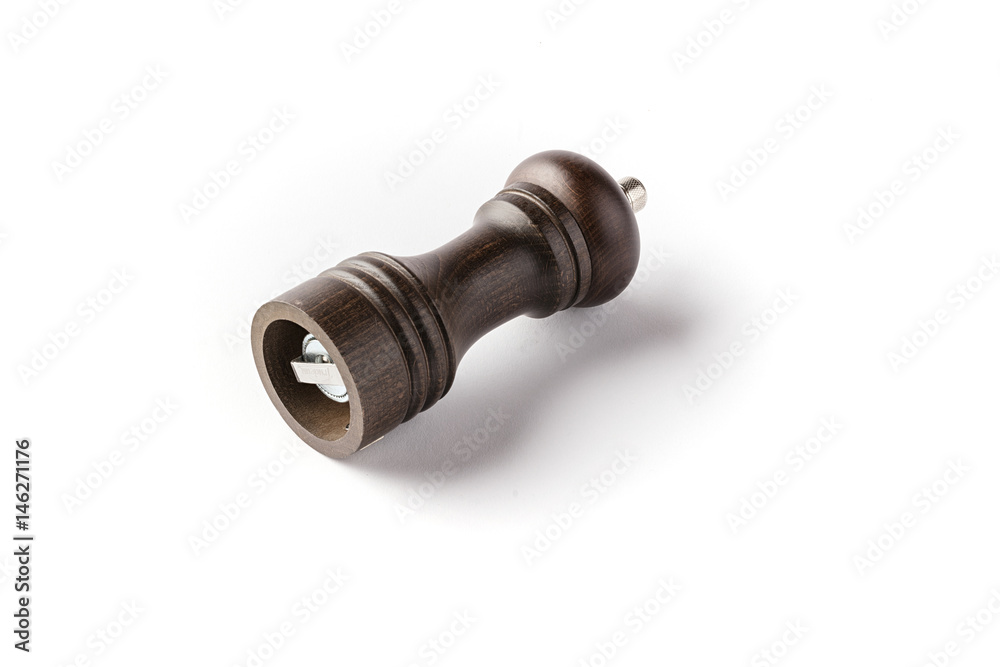 Wooden laying pepper mill on a white background