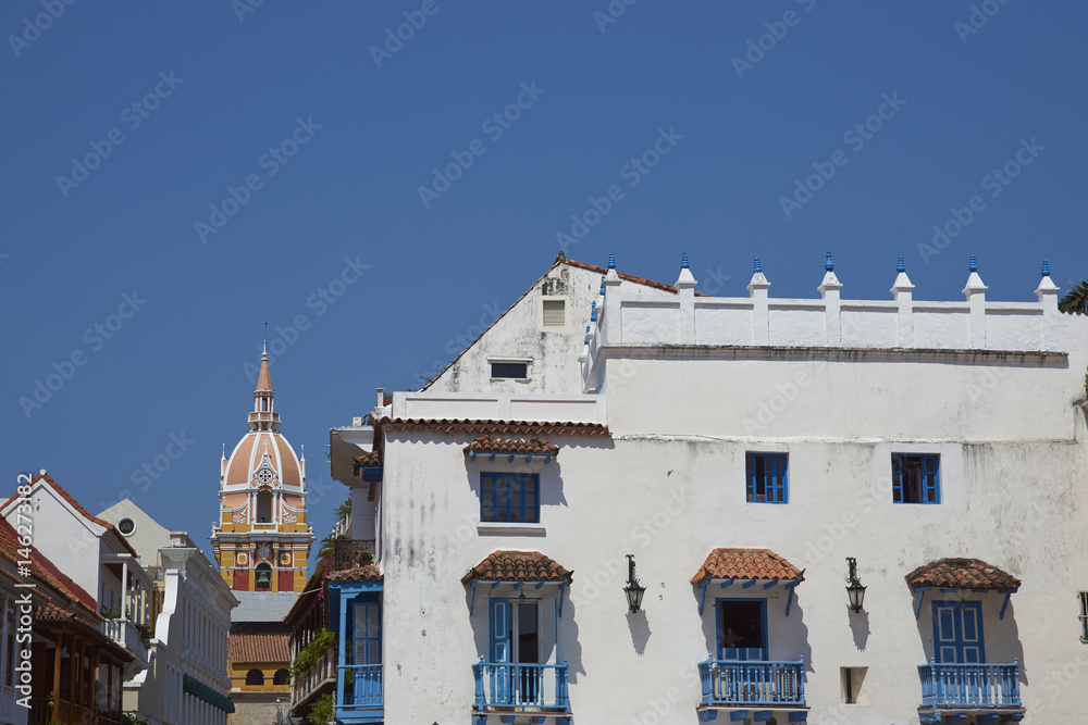 Stone tower of the historic Cathedral of Saint Catherine of Alexandria rising above the rooftops of the Spanish colonial city of Cartagena de Indias, Colombia.