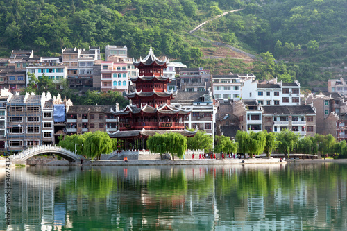 Ancient Pagoda in Zhenyuan town on Wuyang River in Guizhou Province, China photo