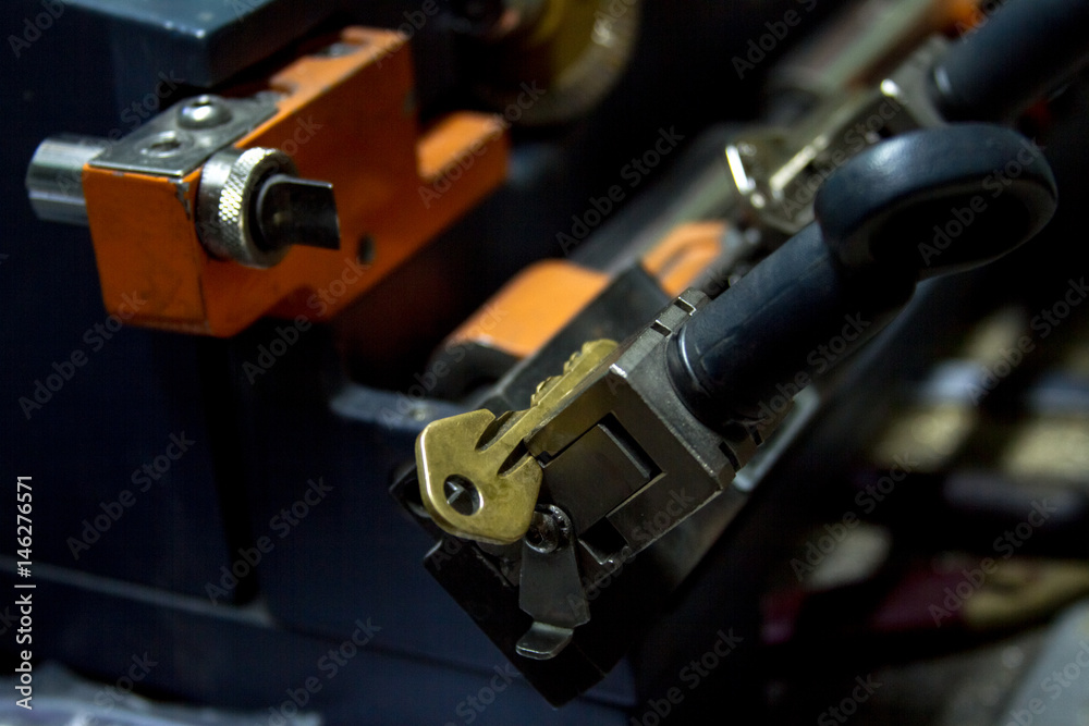 Machine production of duplicate metal key. Machine production of duplicate metal key.