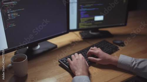 Professional IT man writing programming code