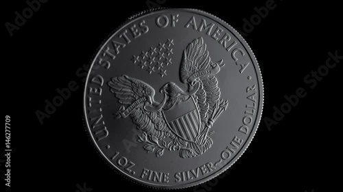 close-up shot one dollar silver eagle coin flying photo