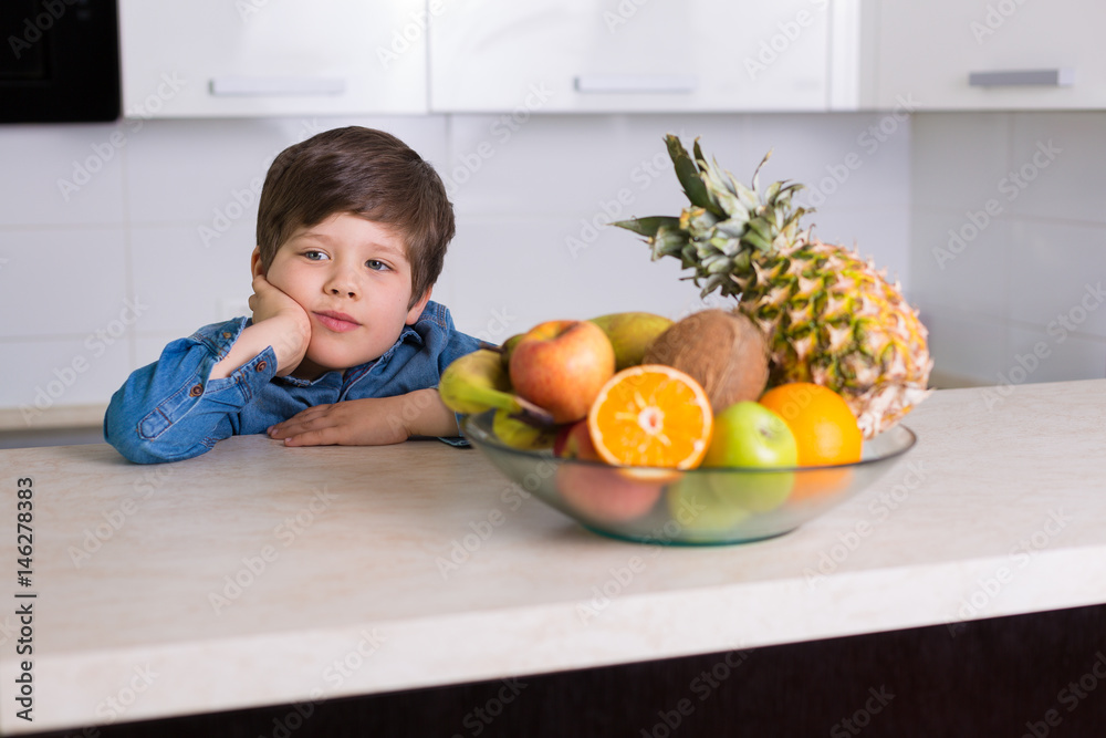 Little boy with a bowl of fresh fruits Little boy with a bowl of fresh fruits