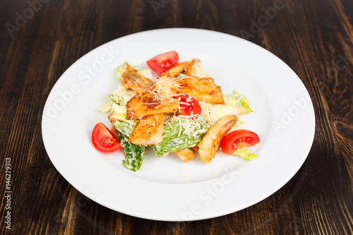 Plate with fresh caesar salad with chicken