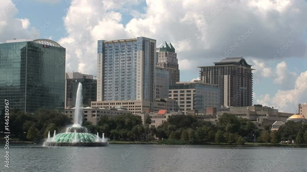 Downtown Orlando. Lake Eola in the park, surrounded buildings and home for swans and other Florida birds - 1 Downtown Orlando. Lake Eola in the park, surrounded buildings and home for swans and other Florida birds - 1