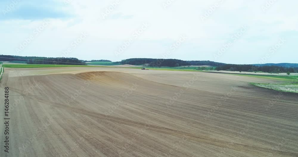 Tractor plowing field. Agriculture background. Tractor plowing field. Agriculture background.