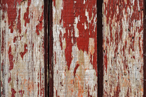 red boards with cracked paint