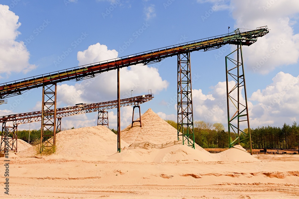 Conveyor belts and sand heaps. Construction industry. Sand quarry. Horizontal  photo
