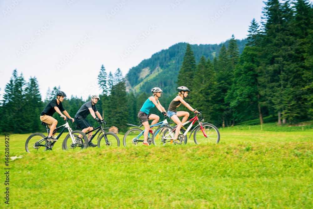 Obraz premium Family Of Four Cycling