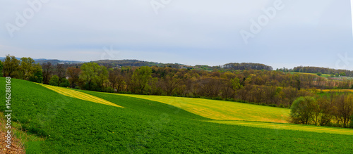 Pennsylvania countryside and farms in spring near Kutztown. Fields just starting to be plowed.