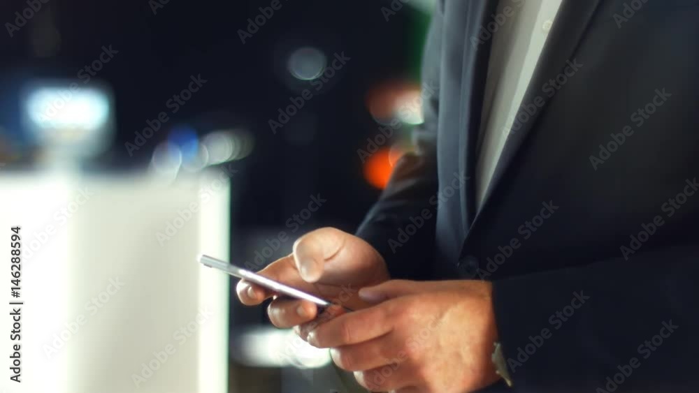 Using a Smartphone, sliding the screen and taping, close up shot with soft bokeh Using a Smartphone, sliding the screen and taping, close up shot with soft bokeh