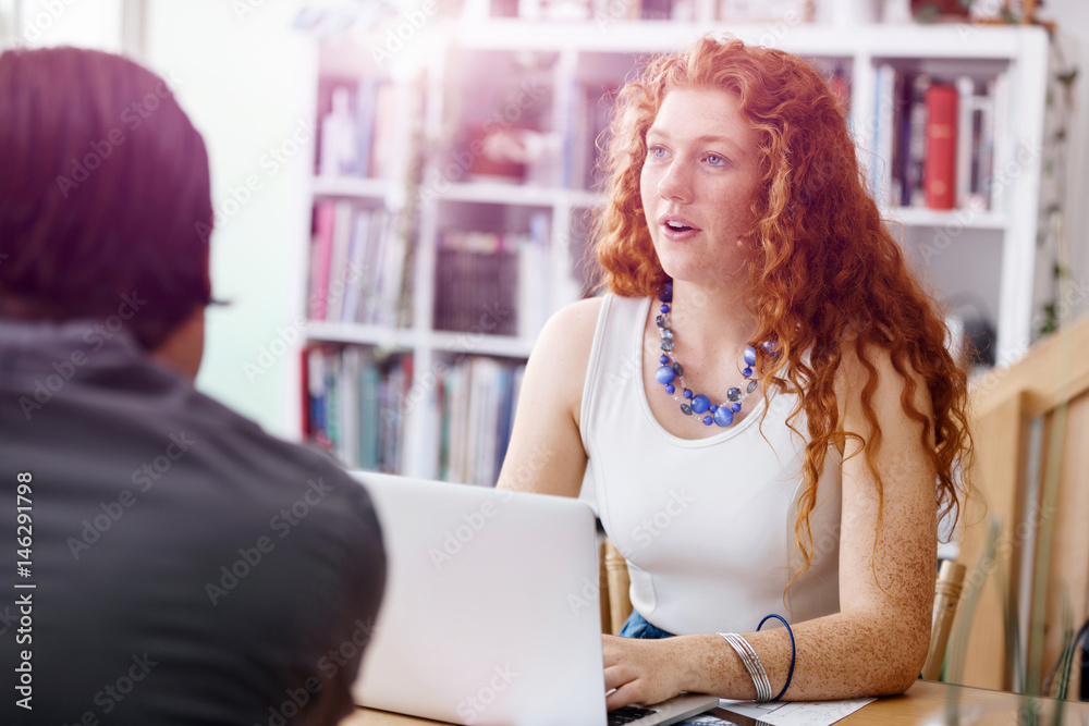 Successful young business executives meeting at the office Successful young business executives meeting at the office