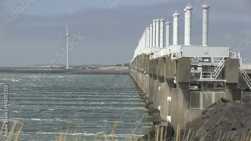 Storm surge barrier in The Netherlands, the sea shore near the barrier - 1 photo