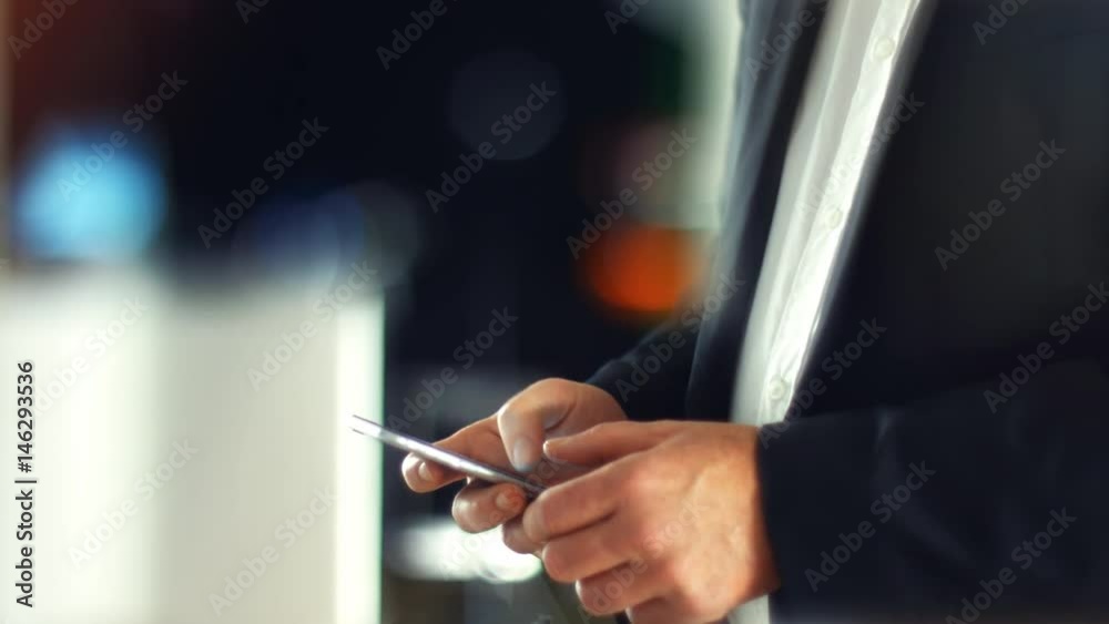 Using a Smartphone, sliding the screen and taping, close up shot with soft bokeh Using a Smartphone, sliding the screen and taping, close up shot with soft bokeh