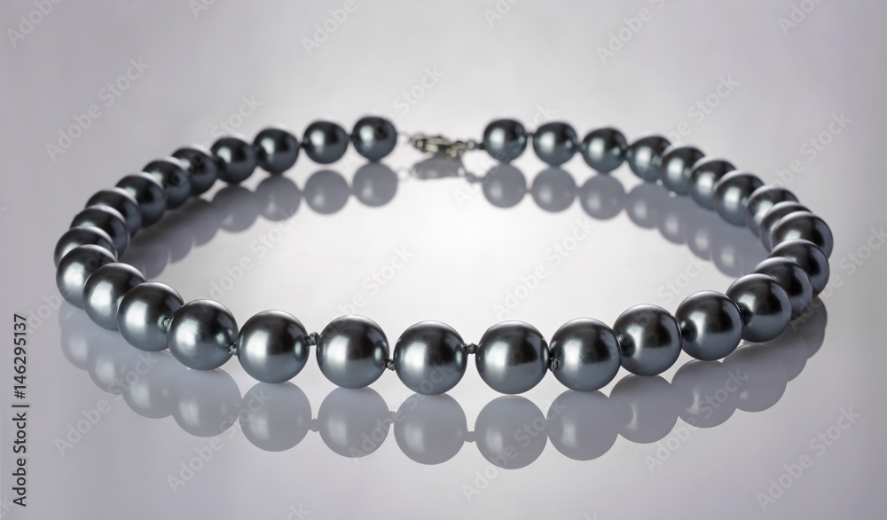 Luxury elegant silver pearl necklace close-up Luxury elegant silver pearl necklace close-up