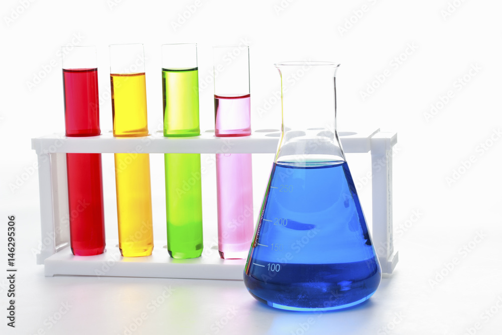 test tubes in a test on white background for symbolic photo for learning and researching. test tubes in a test on white background for symbolic photo for learning and researching.