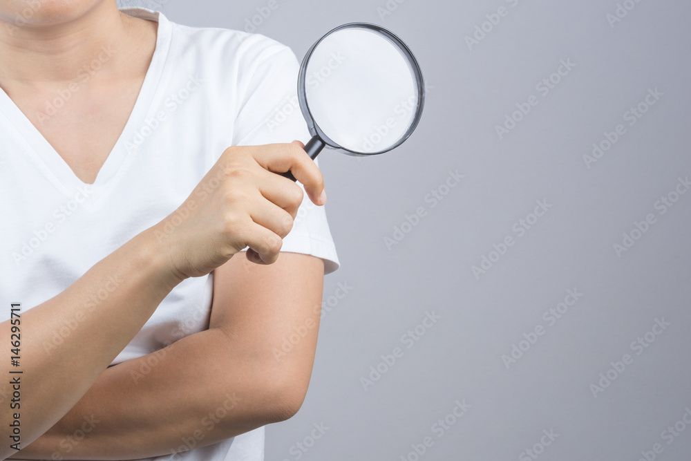 Woman hand holding magnifier Woman hand holding magnifier