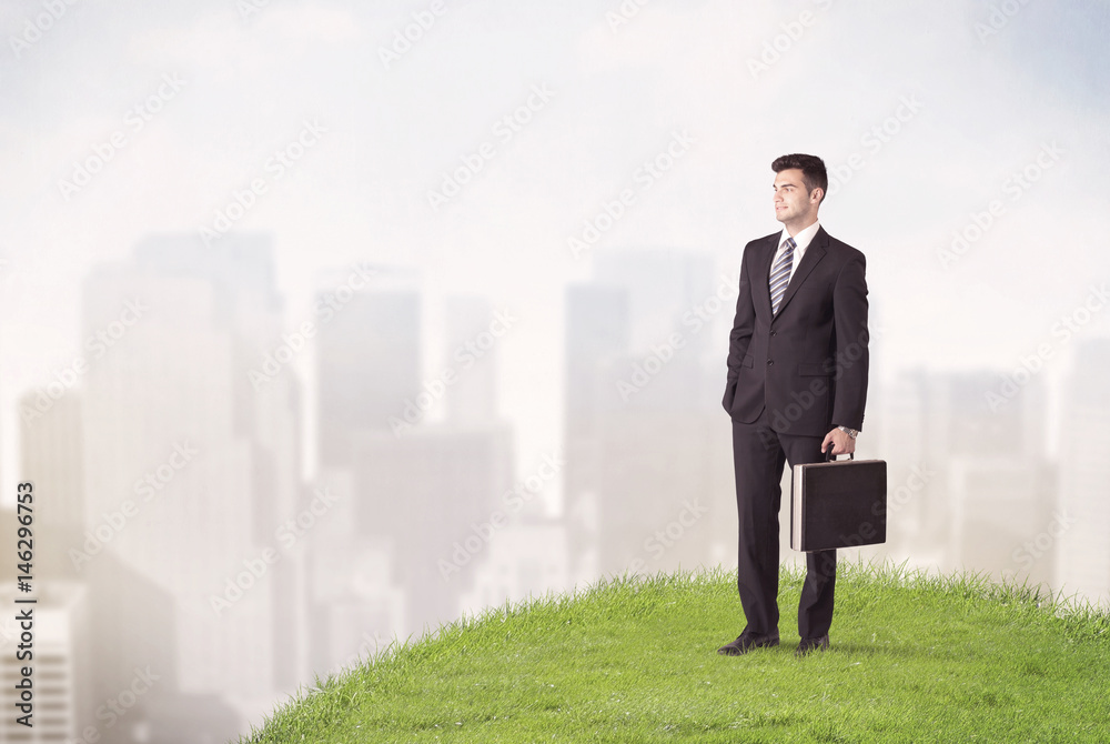 man standing in front of city landscape man standing in front of city landscape