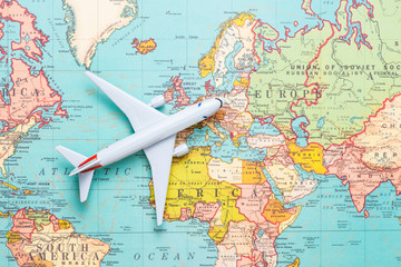 Travel. Trip. Vacation - Top view airplane with touristic map