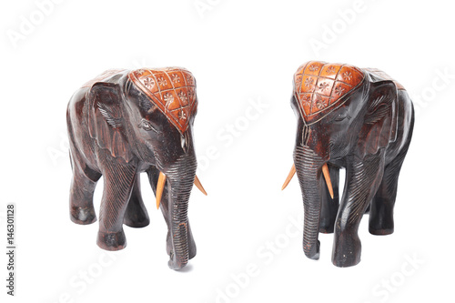 Fototapeta Naklejka Na Ścianę i Meble -  Two wooden elephants model handicraft isolated on white background.
