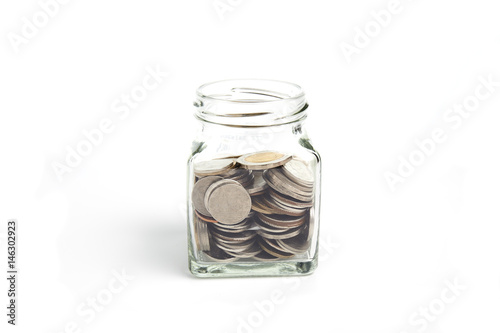 Coins (Thai Baht) in a jar isolated on white background. Saveings and Investment concept.