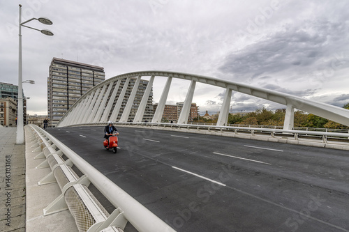 Red scooter on the Exposicion Bridge, Valencia, Spain