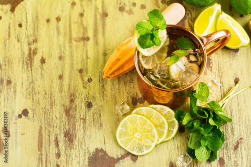 Canvas Print Mojito cocktail with mint, lime in copper mug