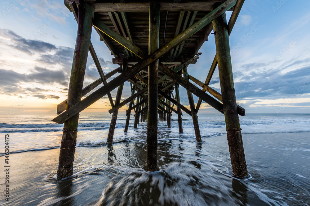 Isle of Palms Pier at sunrise in Charleston, South Carolina Isle of Palms Pier at sunrise in Charleston, South Carolina