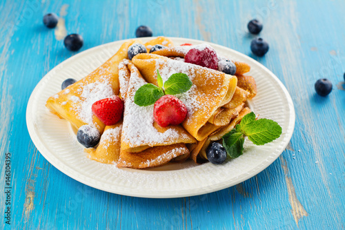 Crepes with berries, blueberry and strawberry