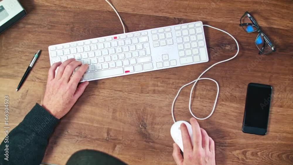 A Man in glasses Works On His Laptop From His Home Office - 2