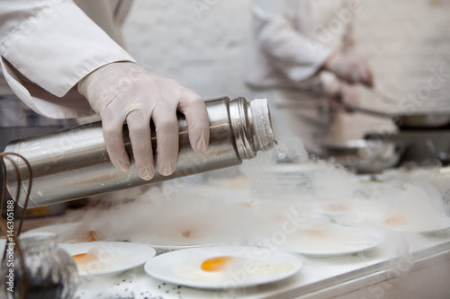 Chef is cooking ice cream with liquid nitrogen