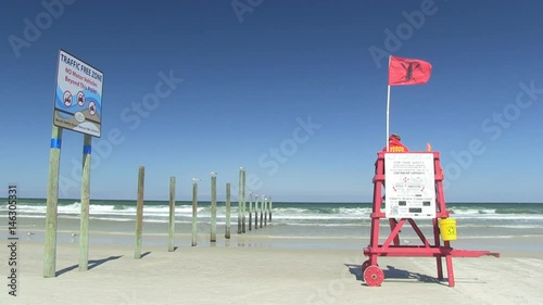 Daytona Beach, Atlantic coast, Florida. Daytona Beach pier and a manned lifeguard tower with the red flag - 7