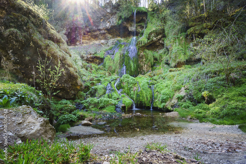 Cascade du Moulin de Vermondans, einstige Quelle für mehrstufige Wassernutzung im französischen Jura im Tal der Reverotte bei wenig Wasser photo