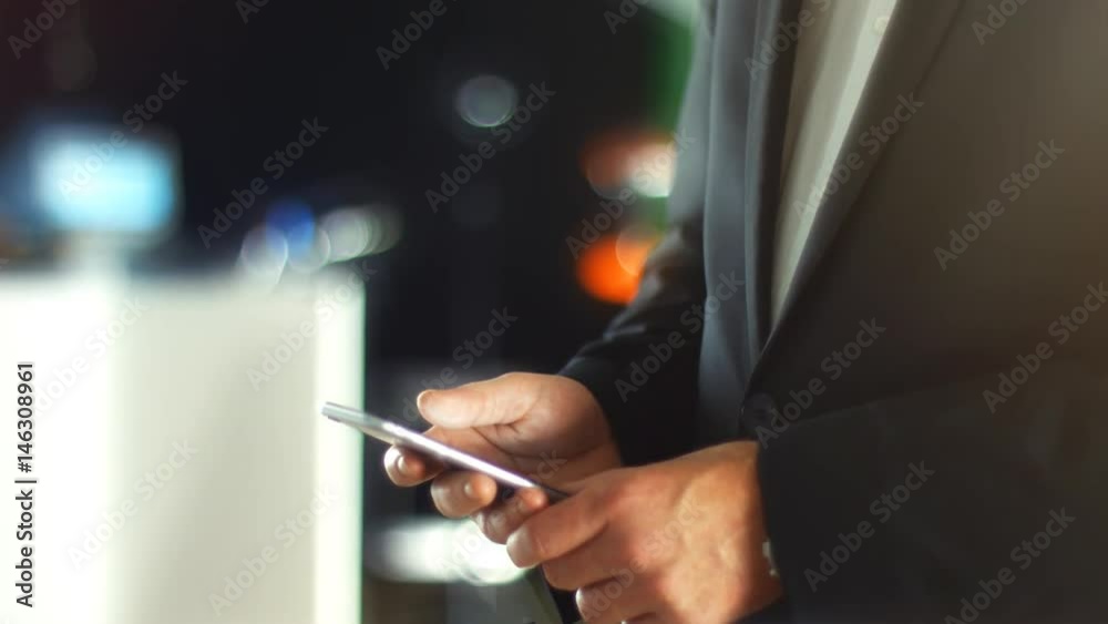 Using a Smartphone, sliding the screen and taping, close up shot with soft bokeh Using a Smartphone, sliding the screen and taping, close up shot with soft bokeh