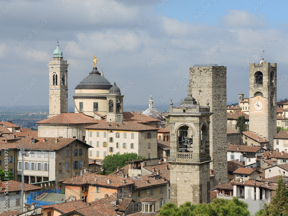 Fototapeta premium Bergamo - Old city (Città Alta), Italy. Landscape on the city center, the old towers and the clock towers from the old fortress