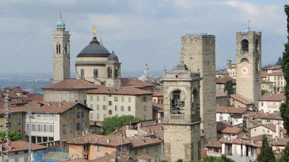 Bergamo - Old city (Città Alta), Italy. Landscape on the city center, the old towers and the clock towers from the old fortress Bergamo - Old city (Città Alta), Italy. Landscape on the city center, the old towers and the clock towers from the old fortress