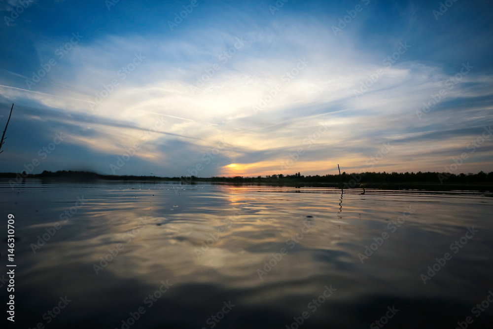 Beautiful sunset on the lake shore