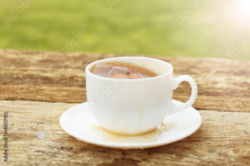 cup of tea with lemon on wooden background