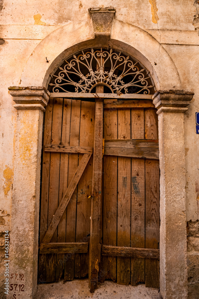 Old gate in the ancient town in Montenegro.