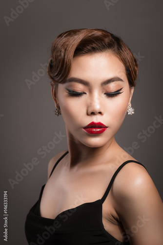 Portrait of a beautiful young woman with brown hair. Beauty and skin care concept