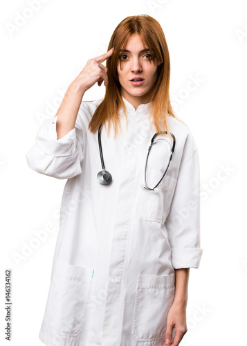 Young doctor woman making crazy gesture