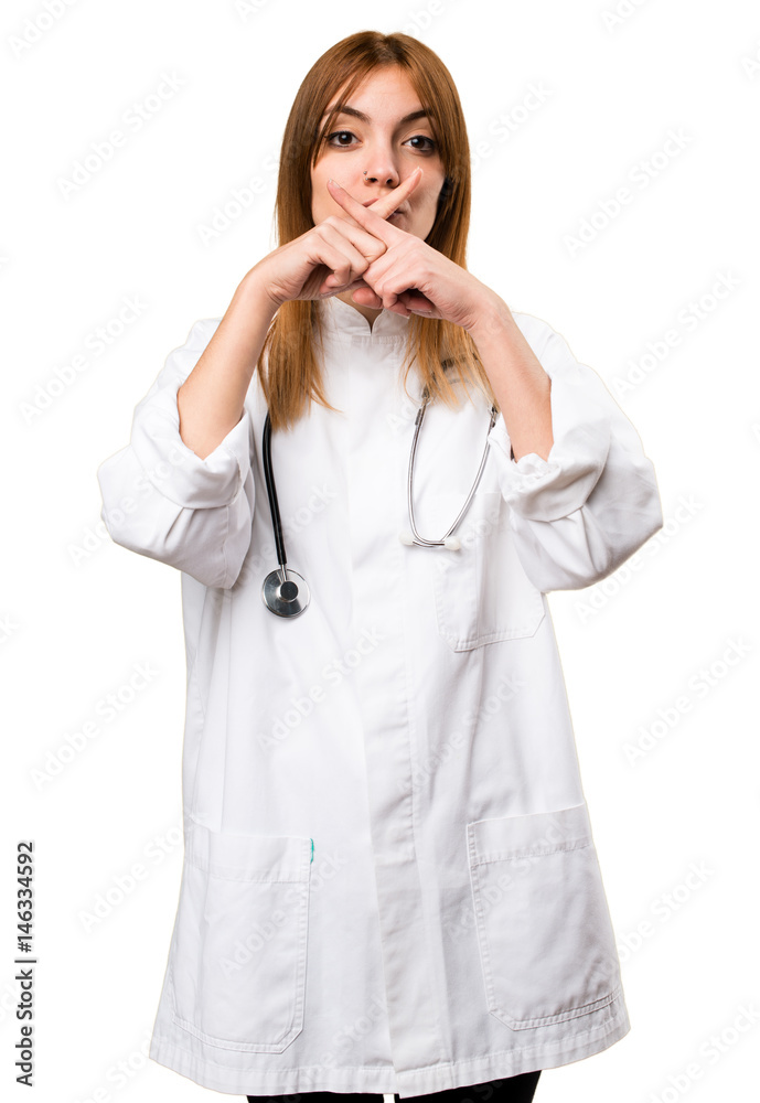 Young doctor woman making silence gesture Young doctor woman making silence gesture