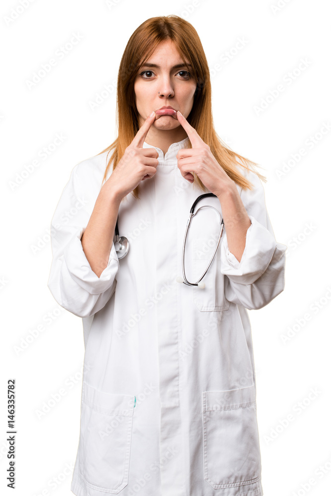 Sad young doctor woman